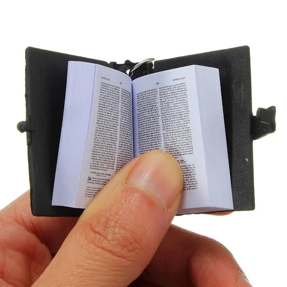 Mini bible in hand